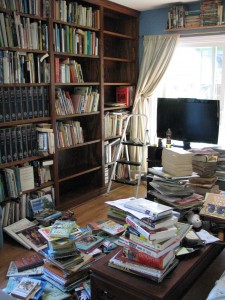 Books piled alphabetically... a little later there was a small avalanche.