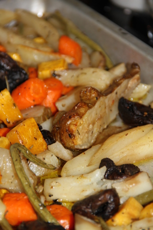 Jerusalem artichokes, carrots, beans, mushrooms, potatoes and squash are roasted with garlic, rosemary and olive oil.    Yum.